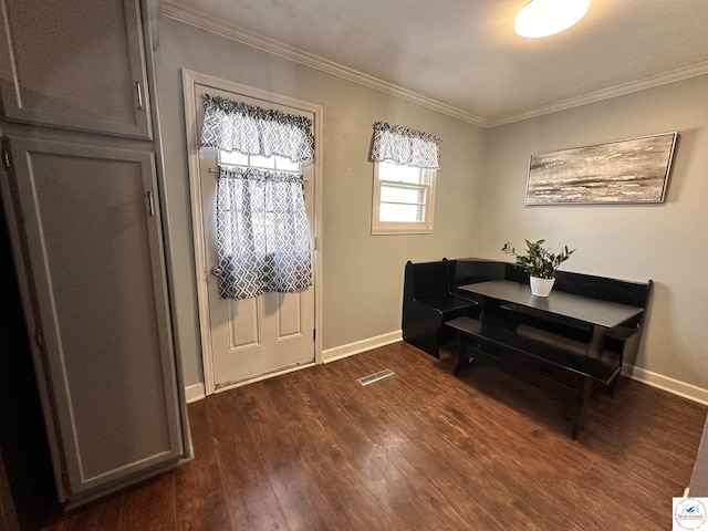 entrance foyer with ornamental molding, dark wood-style flooring, and baseboards