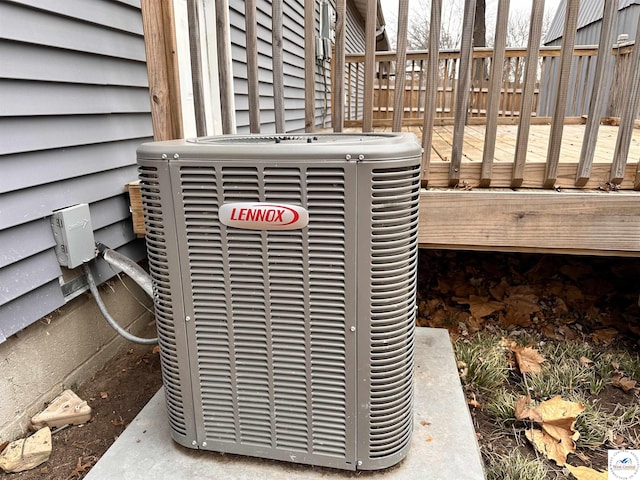 exterior details featuring fence and central AC unit