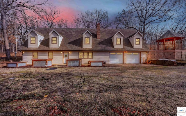 cape cod home featuring driveway