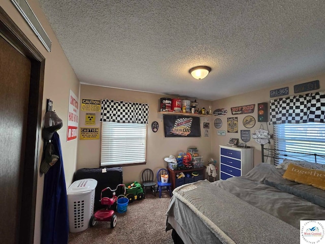 carpeted bedroom featuring a textured ceiling