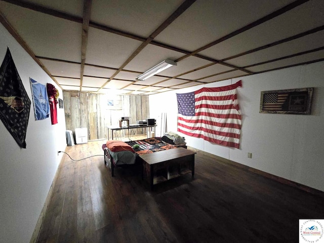 recreation room with baseboards and wood finished floors