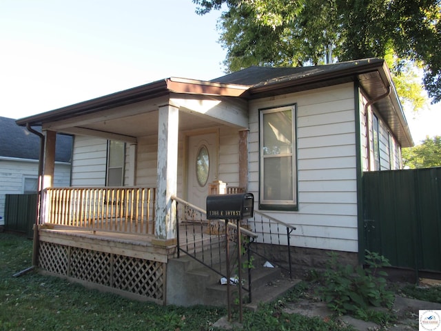 back of house with a wooden deck