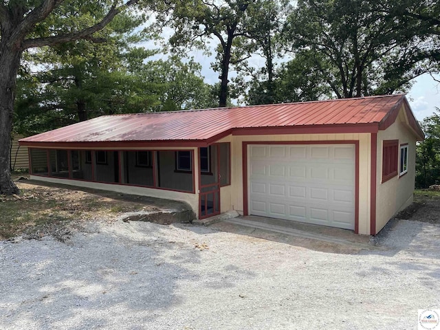 exterior space with gravel driveway