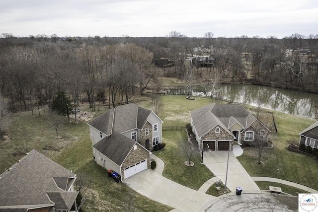 aerial view with a view of trees and a water view