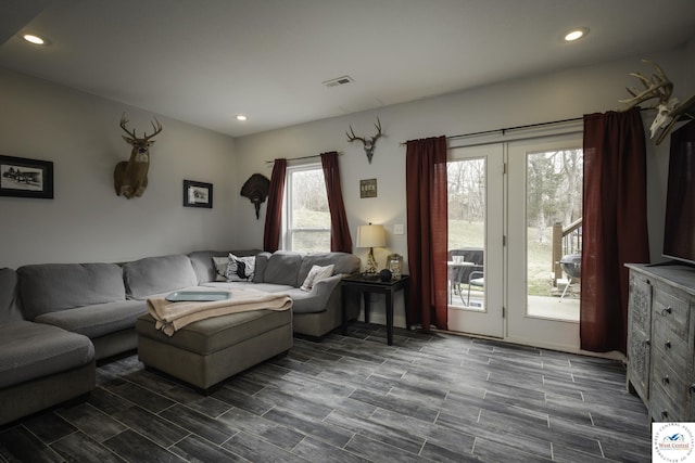 living area featuring visible vents, recessed lighting, and wood tiled floor