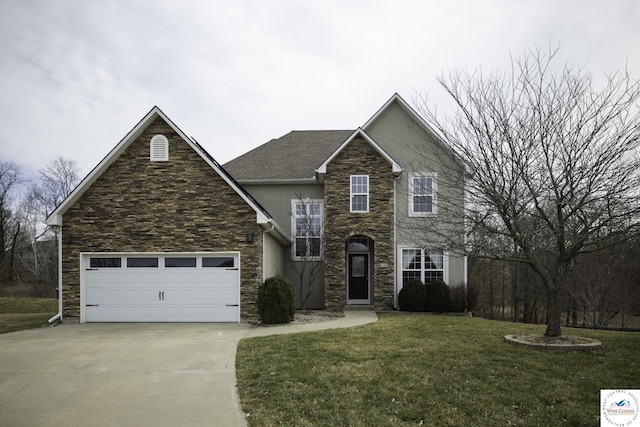 traditional home with a front yard, stucco siding, a garage, stone siding, and driveway