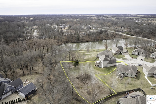 birds eye view of property with a water view and a residential view