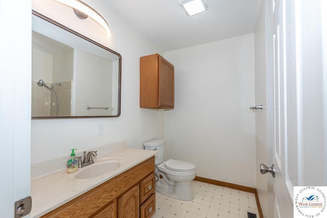 bathroom with tile patterned floors, visible vents, toilet, baseboards, and vanity