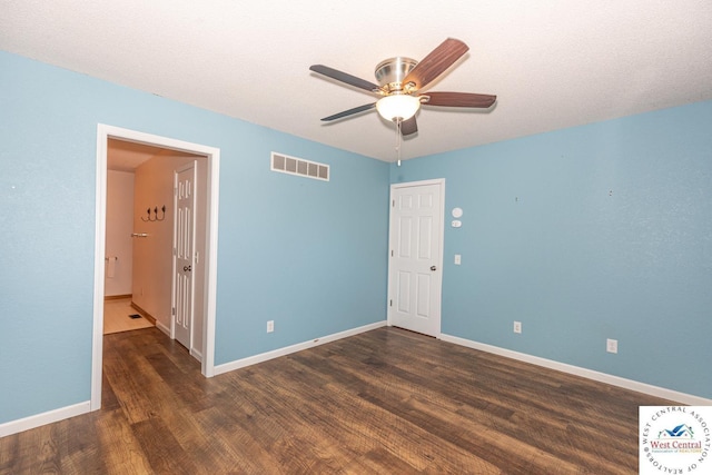 unfurnished bedroom with visible vents, ceiling fan, baseboards, and wood finished floors