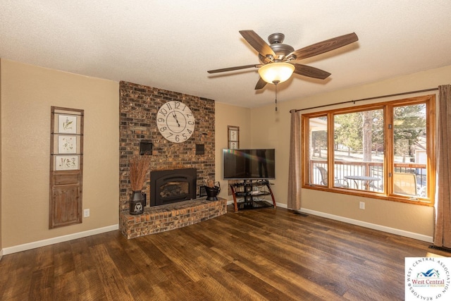 unfurnished living room featuring a textured ceiling, baseboards, and wood finished floors