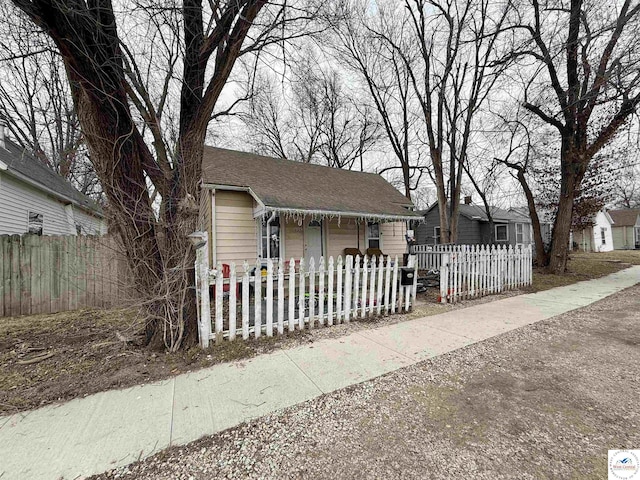 bungalow with a fenced front yard