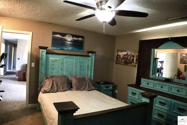 carpeted bedroom with visible vents, a textured ceiling, and ceiling fan