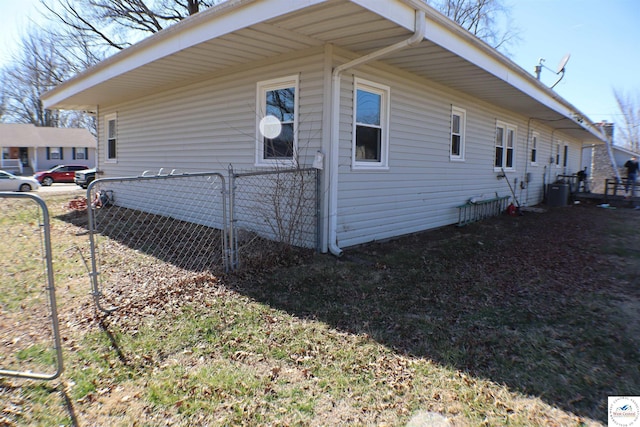 view of side of property featuring fence