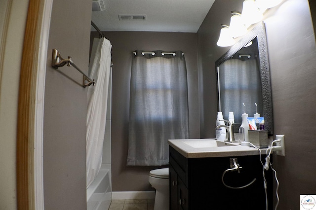 bathroom featuring vanity, visible vents, tile patterned floors, toilet, and shower / tub combo with curtain