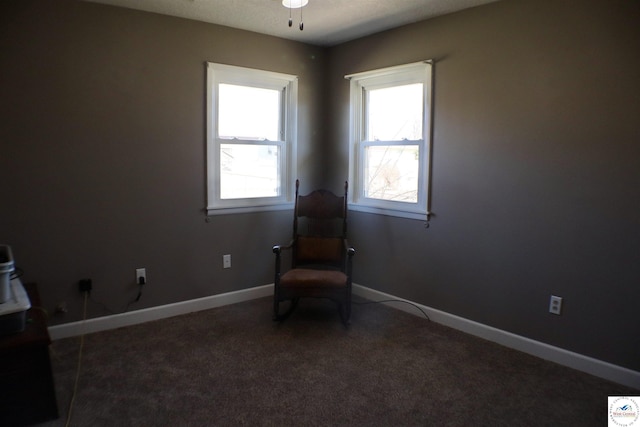 unfurnished room featuring a ceiling fan, carpet, and baseboards