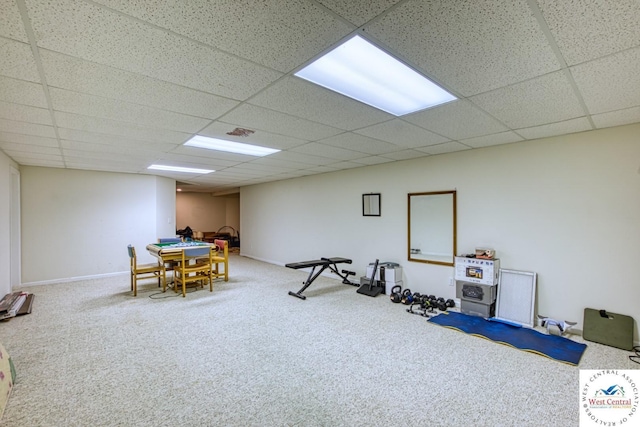 recreation room featuring baseboards, carpet, visible vents, and a drop ceiling