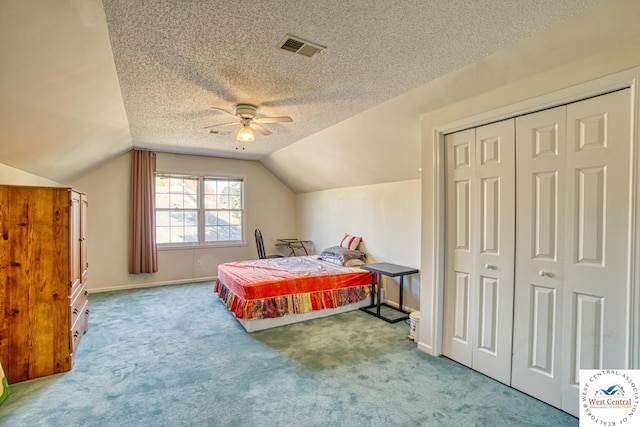 bedroom featuring baseboards, visible vents, vaulted ceiling, a textured ceiling, and carpet flooring