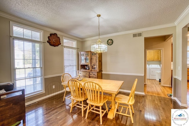 dining space with ornamental molding, wood finished floors, and visible vents