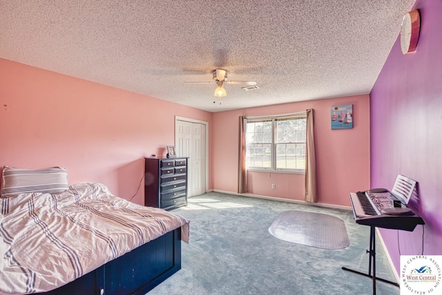 carpeted bedroom featuring a textured ceiling, a ceiling fan, visible vents, baseboards, and a closet