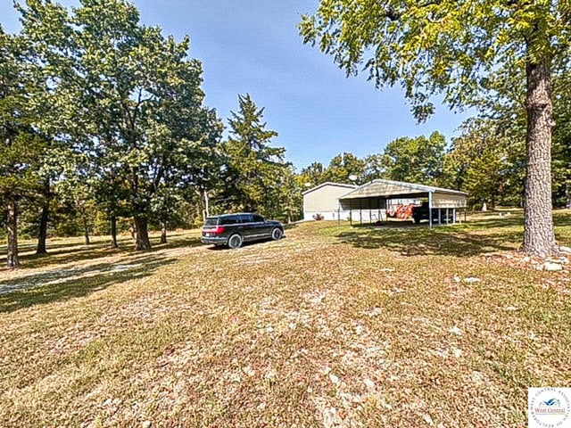 view of yard with a carport