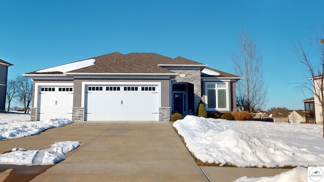 view of front of property with a garage, stone siding, concrete driveway, and stucco siding