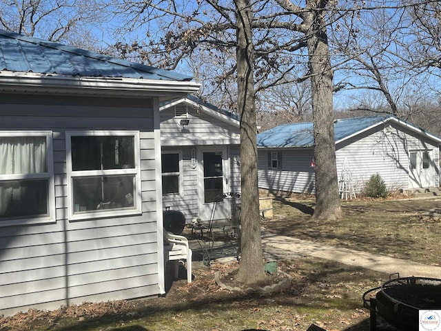 view of home's exterior with metal roof