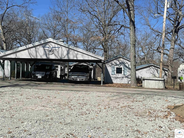 exterior space featuring a carport and driveway