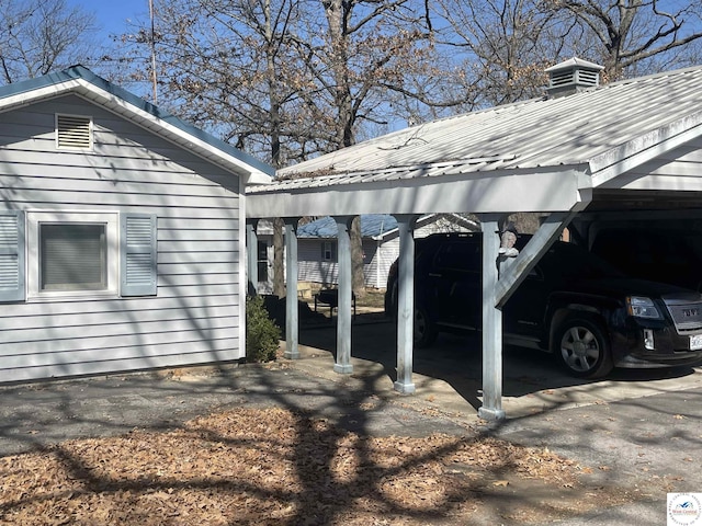 view of home's exterior featuring a carport and metal roof