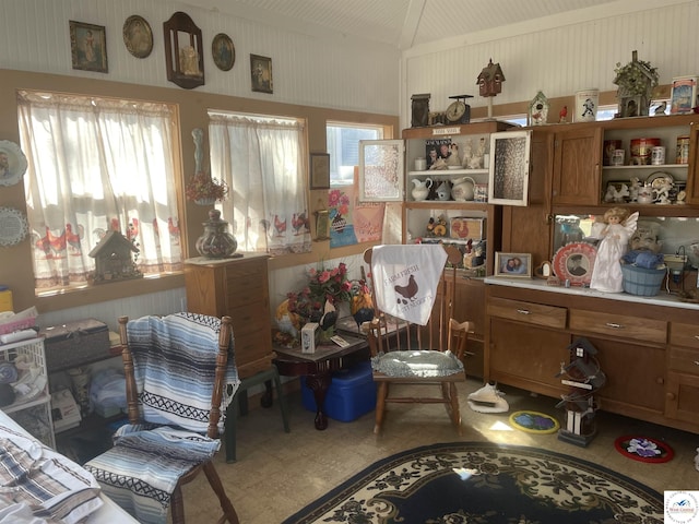 sitting room featuring lofted ceiling