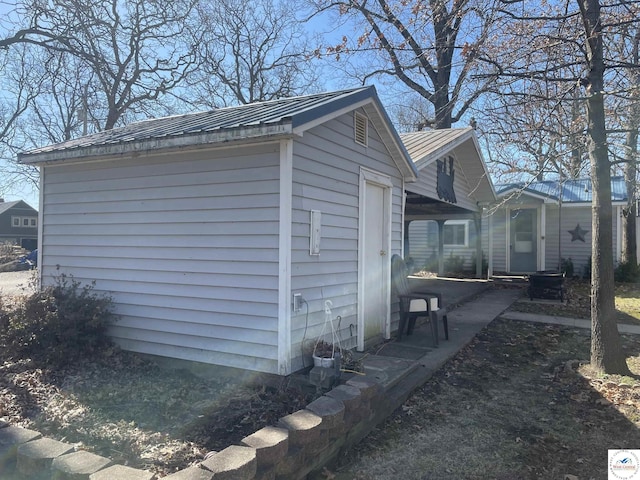 exterior space featuring metal roof