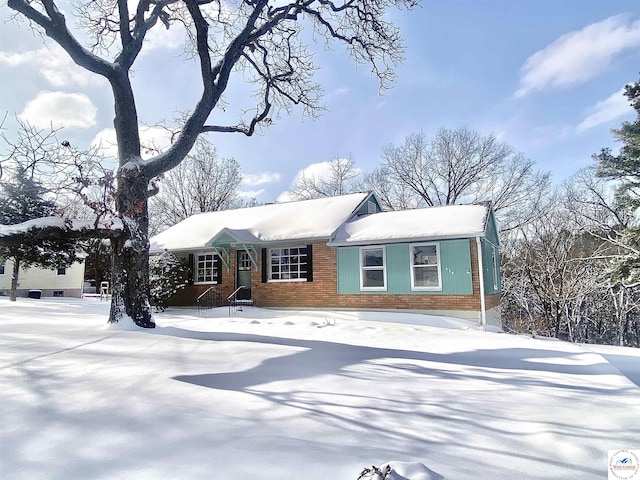 view of front of home with brick siding