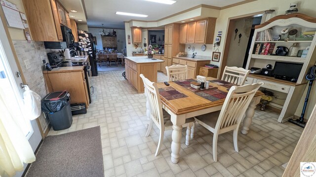 dining room featuring crown molding