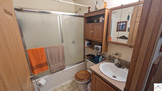 full bath with shower / bath combination with glass door, vanity, and toilet