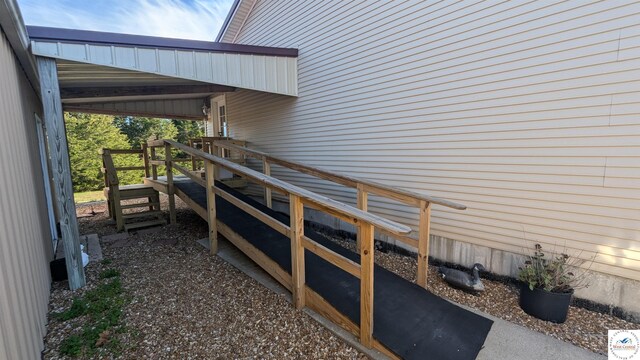 view of side of property featuring stairs