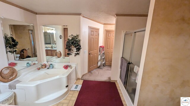 full bathroom with a stall shower, a bath, and crown molding