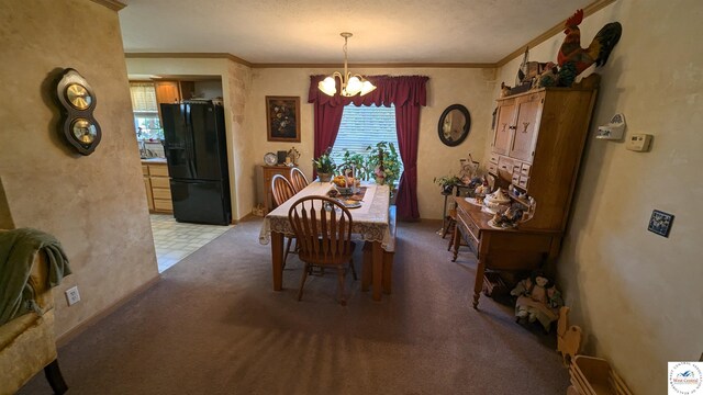 dining area featuring an inviting chandelier, ornamental molding, and light colored carpet