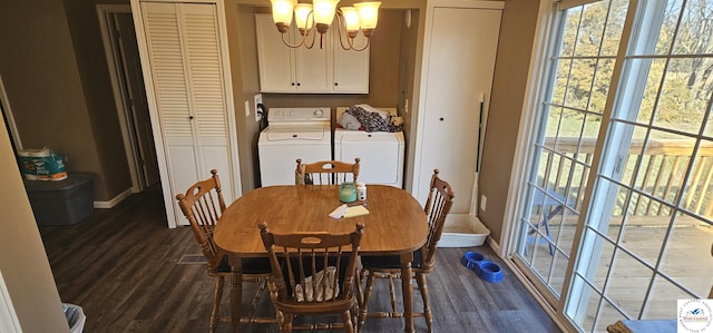 dining room featuring dark wood-type flooring, washer and dryer, a chandelier, and baseboards