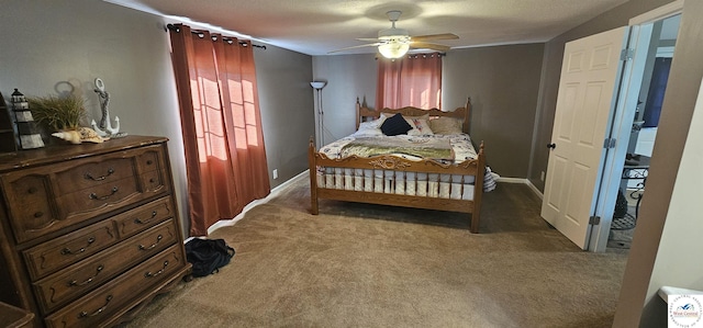 carpeted bedroom with a ceiling fan and baseboards