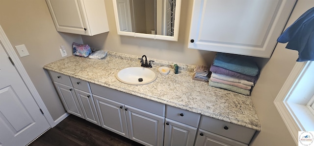 bathroom featuring vanity and wood finished floors