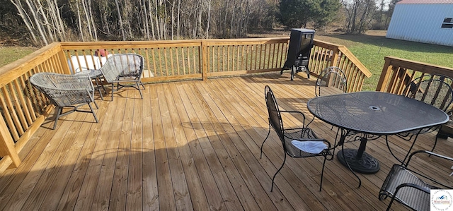 wooden deck featuring outdoor dining space