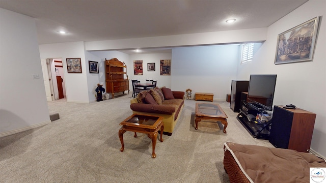 living area featuring recessed lighting, light carpet, and baseboards