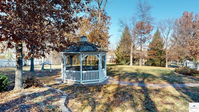 view of yard with fence and a gazebo