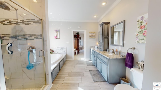 bathroom featuring recessed lighting, ornamental molding, a stall shower, vanity, and a bath