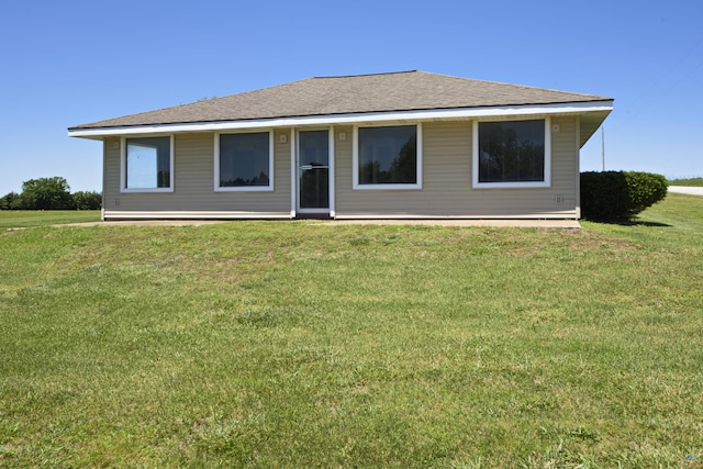 back of house featuring a yard