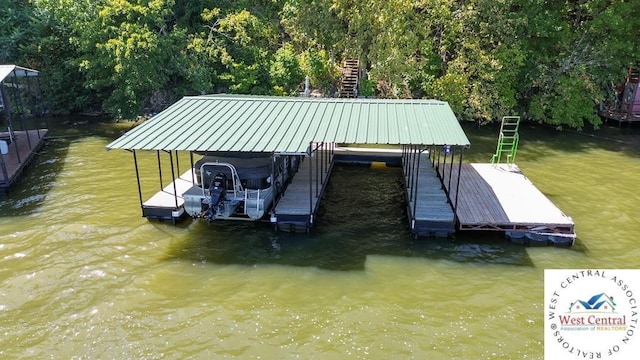 view of dock featuring a water view and boat lift