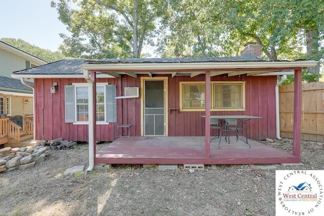 view of outdoor structure with fence