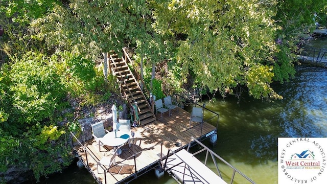 view of dock featuring stairway and a water view