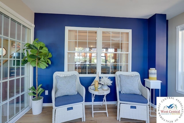 sitting room featuring wood finished floors and baseboards