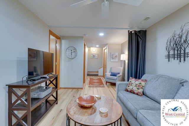 living room with visible vents, baseboards, ceiling fan, light wood-type flooring, and recessed lighting