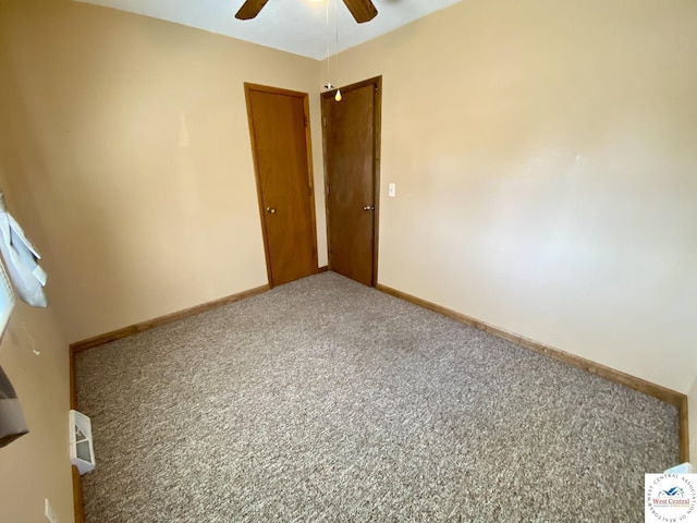 unfurnished bedroom featuring a ceiling fan, baseboards, and carpet flooring